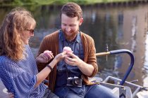 Couple eating cupcakes on canal boat — Stock Photo