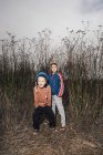 Portrait of two brothers in rural setting — Stock Photo