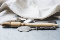 Utensil and tablecloth on grey marble surface in kitchen — Stock Photo