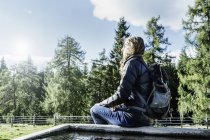 Hiker sitting away at view, Madonna di Pietralba, Trentino-Alto Adige, Italy, Europe — стоковое фото