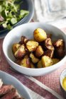 Roast potatoes in bowl, close-up — Stock Photo