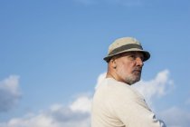 Portrait of senior man in sun hat — Stock Photo