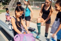 Schoolgirls preparing on school sports field — Stock Photo