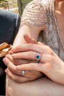 Hands of newlywed couple — Stock Photo