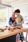 Grandmother and grandson, making pizza together — Stock Photo