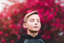 Portrait of boy with eyes closed — Stock Photo