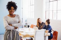 Portrait of african ethnicity woman in office looking at camera smiling — Stock Photo