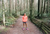 Woman in sport clothing in forest, Vancouver, Canada — Stock Photo