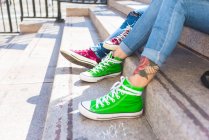 Female feet in trainers on steps, Milan, Italy — Stock Photo