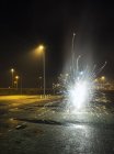Fireworks going off in a car park, on new years eve, Heerenveen, Friesland, Netherlands — Stock Photo