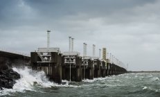 Steel valves at Neeltje-Jans Oosterschelde flood barrier closed to protect the Netherlands during a storm — Stock Photo