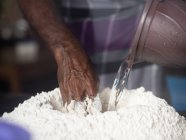 Man preparing roti dough — Stock Photo