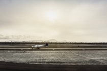 Stationary light aircraft on runway, Lima, Peru — Stock Photo