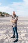 Mature male hipster standing on beach, portrait, Valencia, Spain — Stock Photo