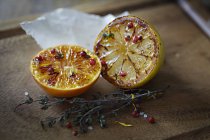 Glazed halves of orange and lemon — Stock Photo