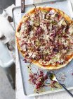 Pork belly and radicchio pizza on baking tray, overhead view — Stock Photo