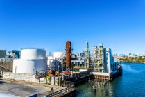 Elevated view of industrial biofuel plant on river waterfront — Stock Photo
