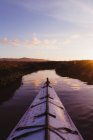 Personal perspective of kayak on river at sunset, Morro Bay, California, USA — Stock Photo