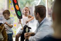 Teacher teaching road safety rules to children — Stock Photo