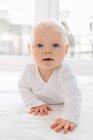 Portrait of Crawling baby girl looking at camera — Stock Photo