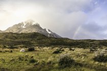 Mountain landscape with tent and rainbow, Torres del Paine national park, Chile — Stock Photo