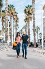 Mature hipster couple strolling on pedestrian area, Valencia, Spain — Stock Photo