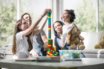 Family playing with building blocks — Stock Photo