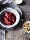Stewed rhubarb with walnuts and pumpkin seeds, elevated view — Stock Photo