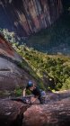 Rock climber climbing sandstone rock, overhead view, Liming, Yunnan Province, China — Stock Photo