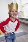 Portrait of young boy in cardboard crown — Stock Photo