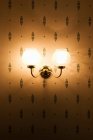 Incorporated lantern on wall with pattern — Stock Photo
