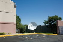 View of satellite dish at parking lot, usa — Stock Photo