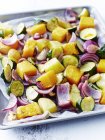 Close up of tasty roast vegetables on tray in kitchen — Stock Photo