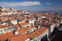 Lisbon rooftops and Tejo River view from Santa Justa Lift, Portugal — стоковое фото
