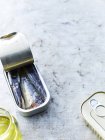 Can of sardines on table, high angle view — Stock Photo
