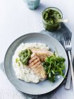 Still life with plate of grilled salmon, rocket and cauliflower puree, overhead view — Stock Photo