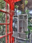View of old metal phone in red telephone booth — Stock Photo