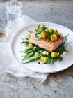 Still life of plate with mango coriander salsa trout — Stock Photo