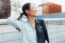 Portrait of businesswoman with leather jacket over shoulder — Stock Photo
