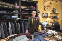 Portrait of senior tailor in tailors shop — Stock Photo