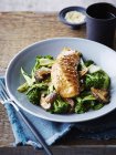 Miso and maple glazed salmon on stir fried asian greens, close-up — Stock Photo