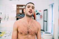 Portrait of bare chested man looking at camera — Stock Photo