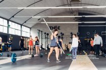 Group of people training in gym — Stock Photo