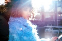 Portrait of woman with afro hair and fur coat — Stock Photo