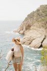 Woman in sun hat looking at view, Tossa de mar, Catalonia, Spain — Stock Photo