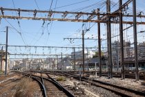 Railway tracks and power lines in urban city, France — Stock Photo