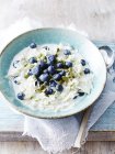 Bowl of fresh blueberries and apple oats — Stock Photo
