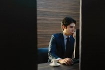 Businessman working in business centre in hotel — Stock Photo