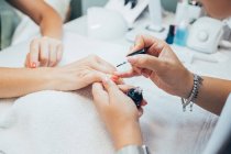 Woman getting a manicure in a beauty salon. — Stock Photo