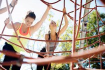 Friends rope climbing in park, close-up view — Stock Photo